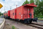 A KCS caboose and F Unit are on display by the Decatur Depot   